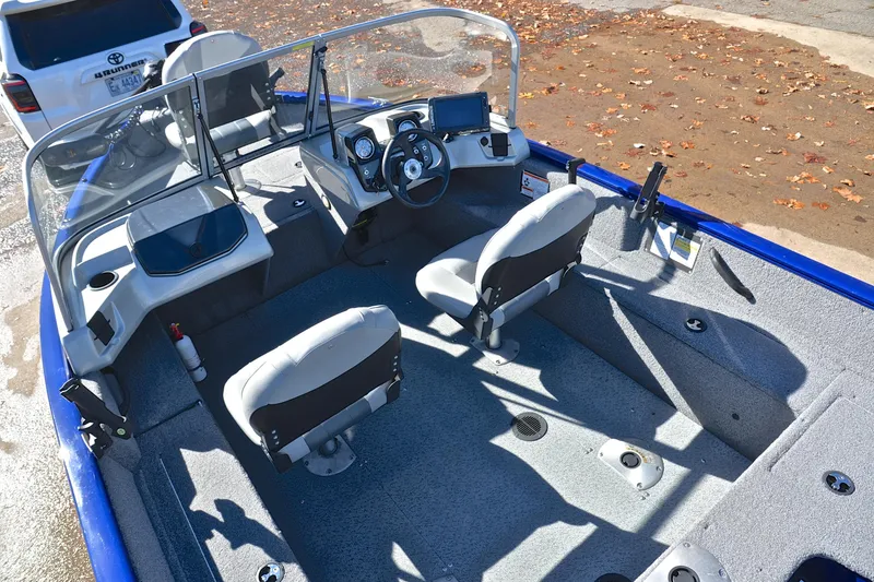 Slide: The Image of 2017 Tracker Pro Guide V-16 WT boat interior with dual seats and steering console. - 23