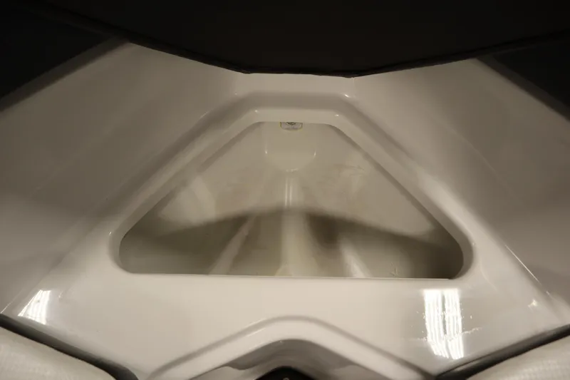 Slide: The Image of 2018 Four Winns H190 boat interior storage compartment, white and spacious design. - 12