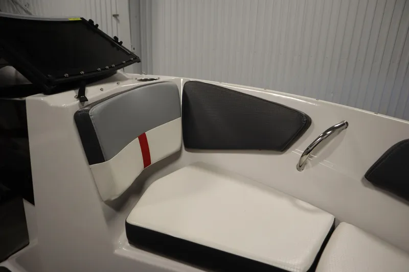 Slide: The Image of 2018 Four Winns H190 boat interior with cushioned seating and chrome handle. - 13
