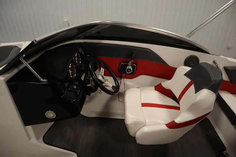 Slide: The Image of 2018 Four Winns H190 boat interior with steering wheel and white-red seating. - 17
