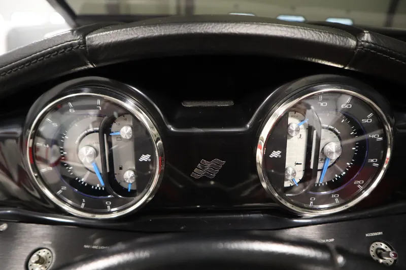 Slide: The Image of Dashboard of a 2018 Four Winns H190 boat with dual gauges and sleek design. - 20