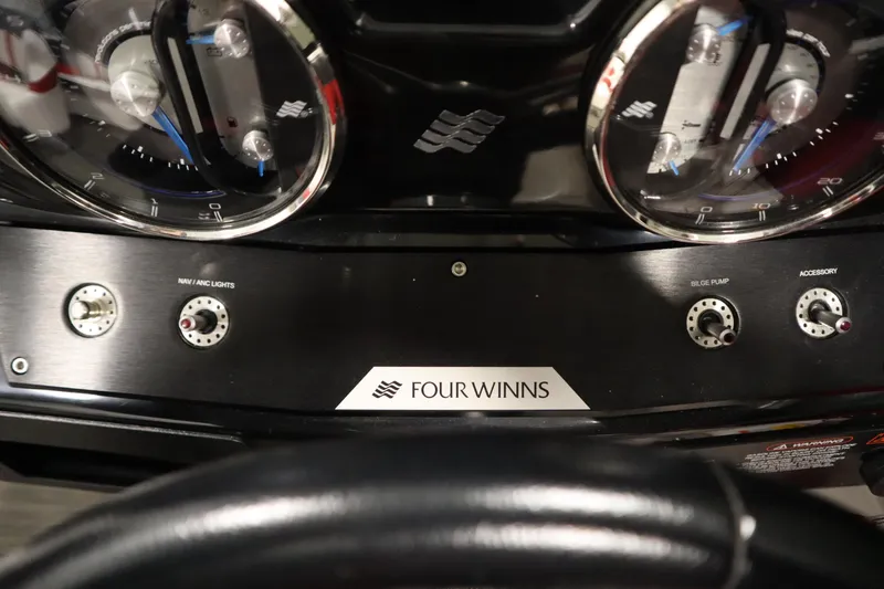 Slide: The Image of Dashboard of 2018 Four Winns H190 boat with gauges and controls. - 21