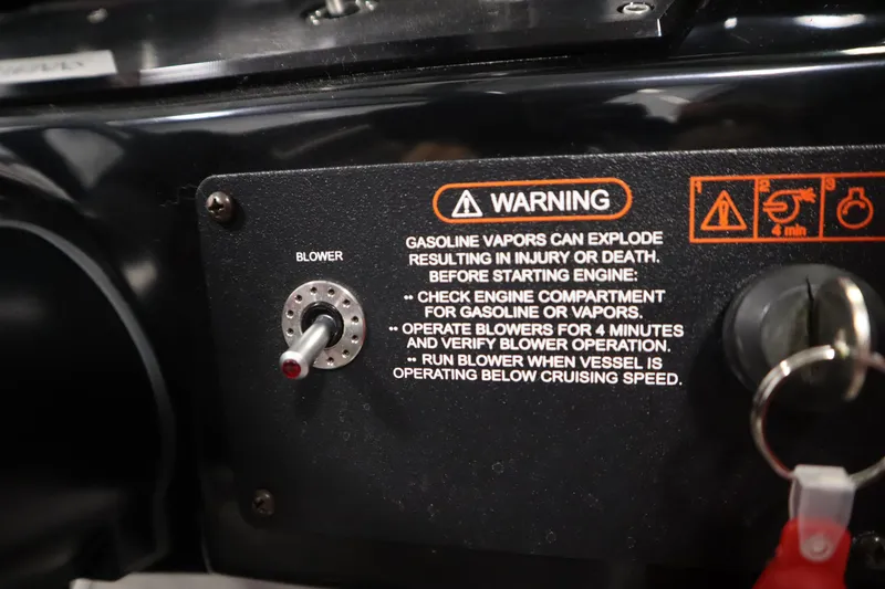 Slide: The Image of 2018 Four Winns H190 warning panel with blower switch and safety instructions. - 23