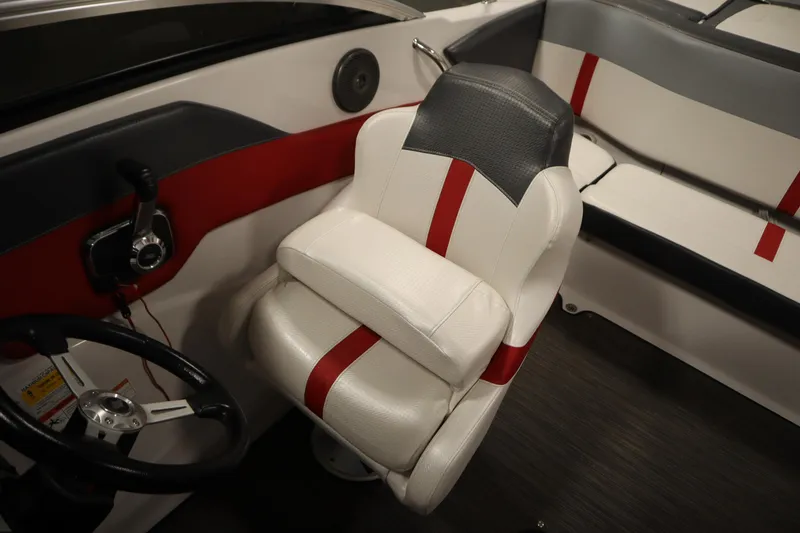 Slide: The Image of 2018 Four Winns H190 boat interior with red and white seating and steering wheel. - 27