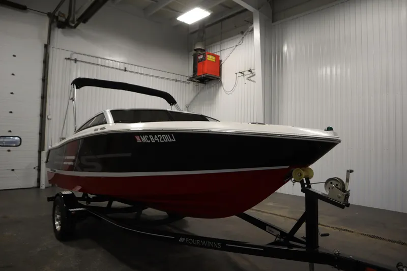 Slide: The Image of 2018 Four Winns H190 boat in warehouse on trailer. - 3