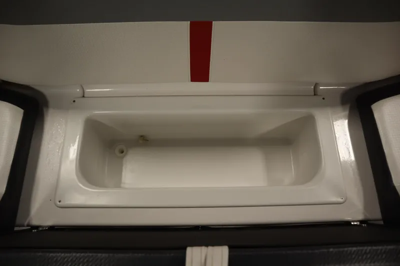 Slide: The Image of 2018 Four Winns H190 boat storage compartment, white interior with red accent. - 34