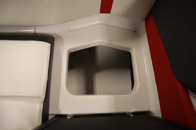 Slide: The Image of Interior storage compartment of 2018 Four Winns H190 boat, featuring white and red upholstery. - 35