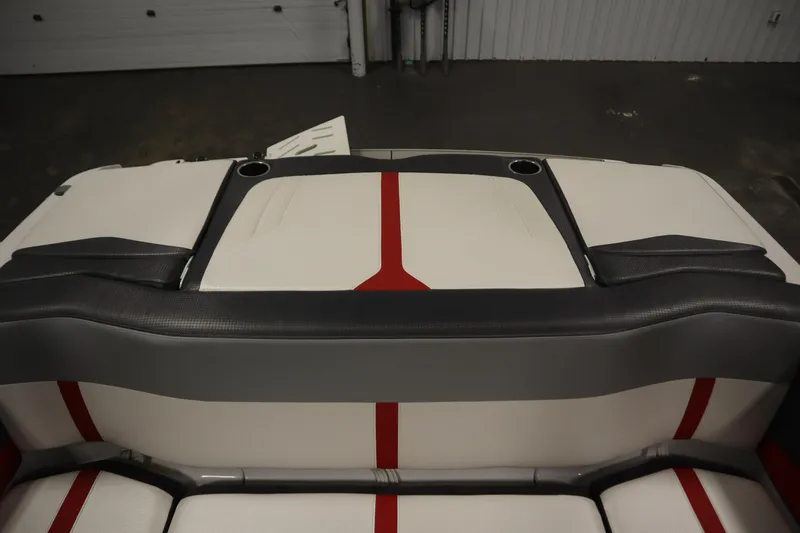 Slide: The Image of 2018 Four Winns H190 boat interior with red and gray accents, featuring cup holders. - 36