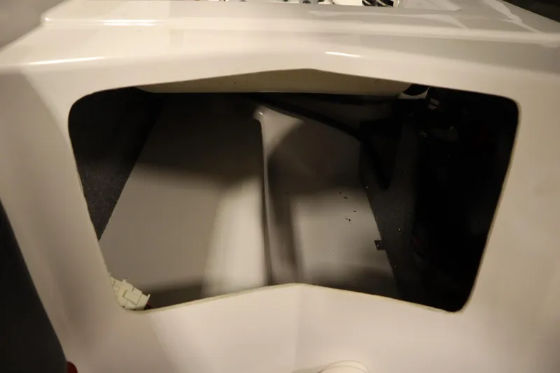 Slide: The Image of Interior compartment of a 2018 Four Winns H190 boat, showing storage space. - 39