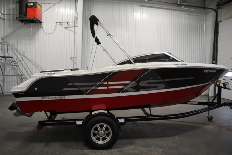 Slide: The Image of 2018 Four Winns H190 boat on trailer in indoor storage facility. - 4