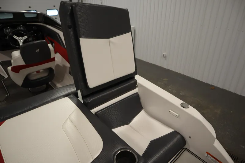 Slide: The Image of 2018 Four Winns H190 boat interior with black and white seating and steering wheel. - 41