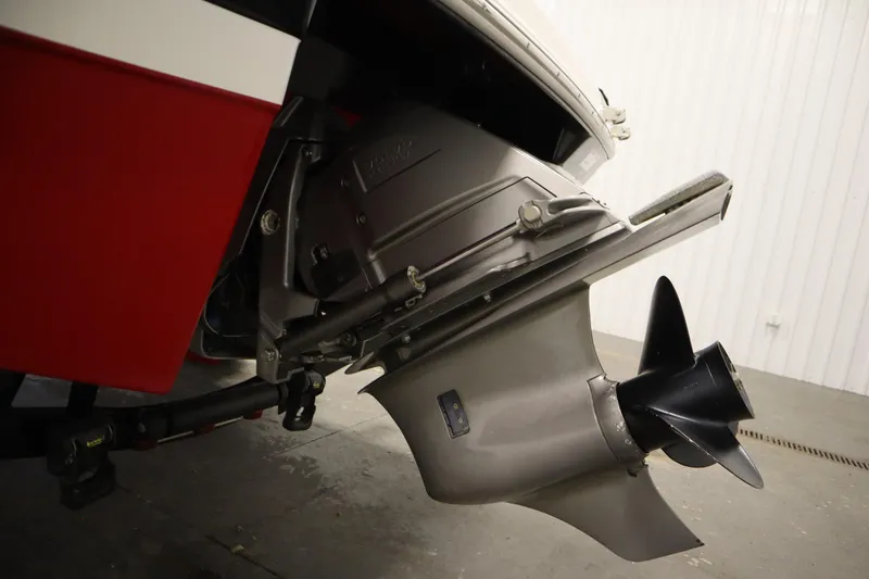 Slide: The Image of 2018 Four Winns H190 boat propeller and stern drive in a garage setting. - 43