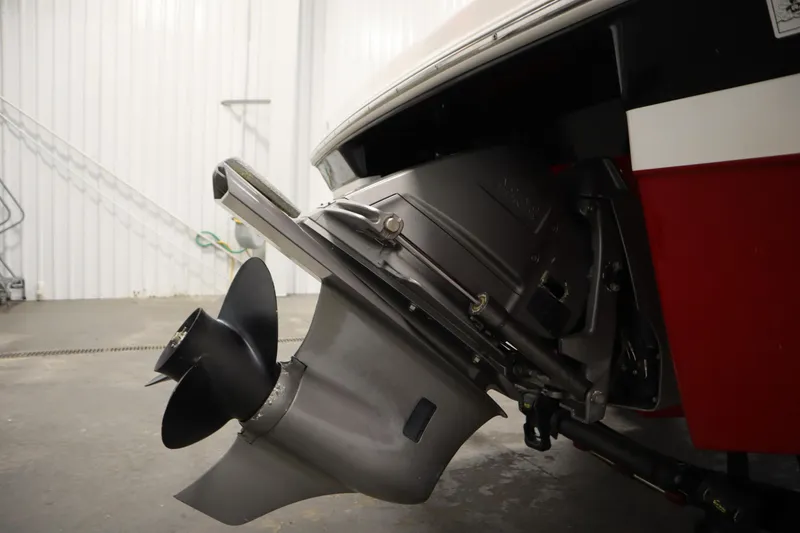 Slide: The Image of 2018 Four Winns H190 boat stern drive and propeller in a garage setting. - 44