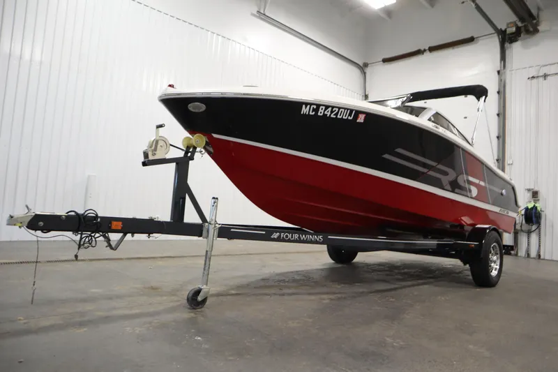 Slide: The Image of 2018 Four Winns H190 boat on trailer in indoor storage facility. - 47