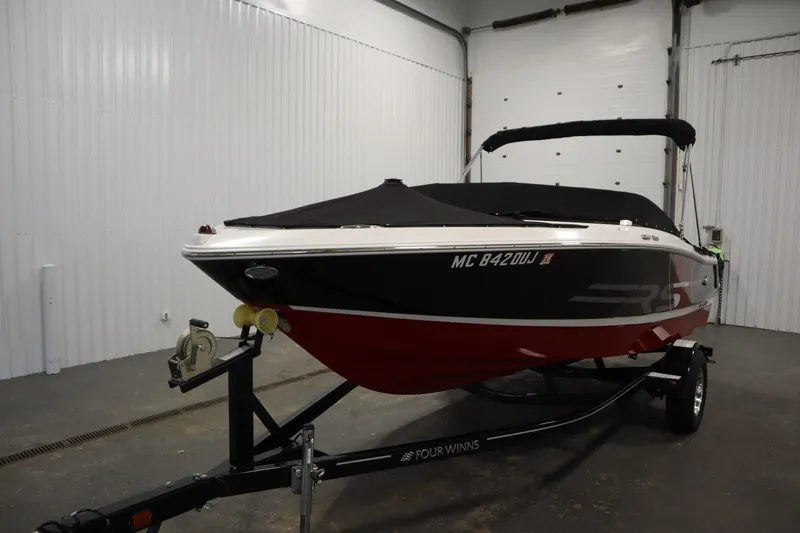 Slide: The Image of 2018 Four Winns H190 boat on trailer in indoor storage facility. - 49