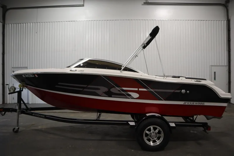 Slide: The Image of 2018 Four Winns H190 boat on trailer in indoor storage. - 8