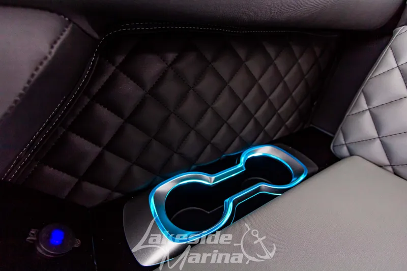 Slide: The Image of Illuminated cup holder in 2025 Godfrey AquaPatio 255 SBC with quilted leather interior. - 25