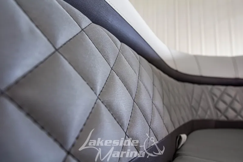Slide: The Image of Close-up of 2025 Godfrey AquaPatio 255 SBC boat seat with quilted design. - 26