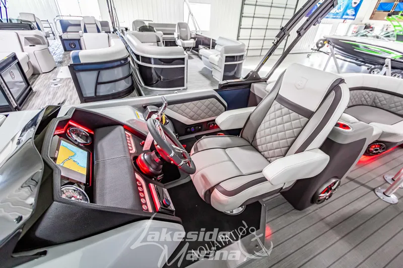 Slide: The Image of Luxurious interior of 2025 Godfrey AquaPatio 255 SBC pontoon boat with modern dashboard and seating. - 37