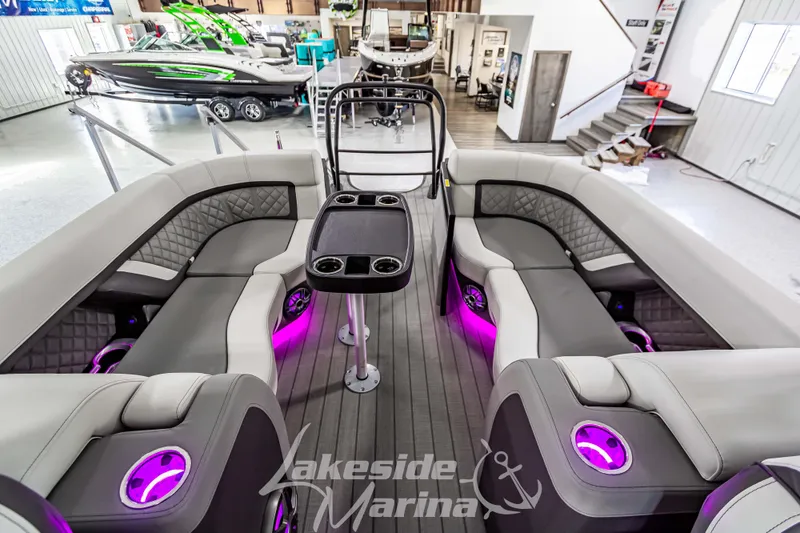 Slide: The Image of Luxurious 2025 Godfrey AquaPatio 255 SBC boat interior with modern seating and ambient lighting. - 40