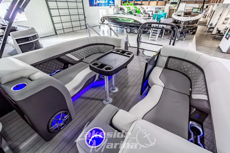 Slide: The Image of Luxurious 2025 Godfrey AquaPatio 255 SBC pontoon boat interior with modern seating and LED lighting. - 41