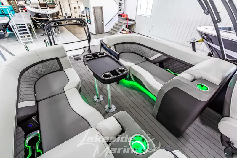 Slide: The Image of Luxurious 2025 Godfrey AquaPatio 255 SBC boat interior with modern seating and ambient lighting. - 42