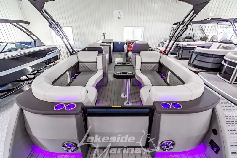 Slide: The Image of Luxurious 2025 Godfrey AquaPatio 255 SBC pontoon boat with spacious seating and ambient lighting. - 47