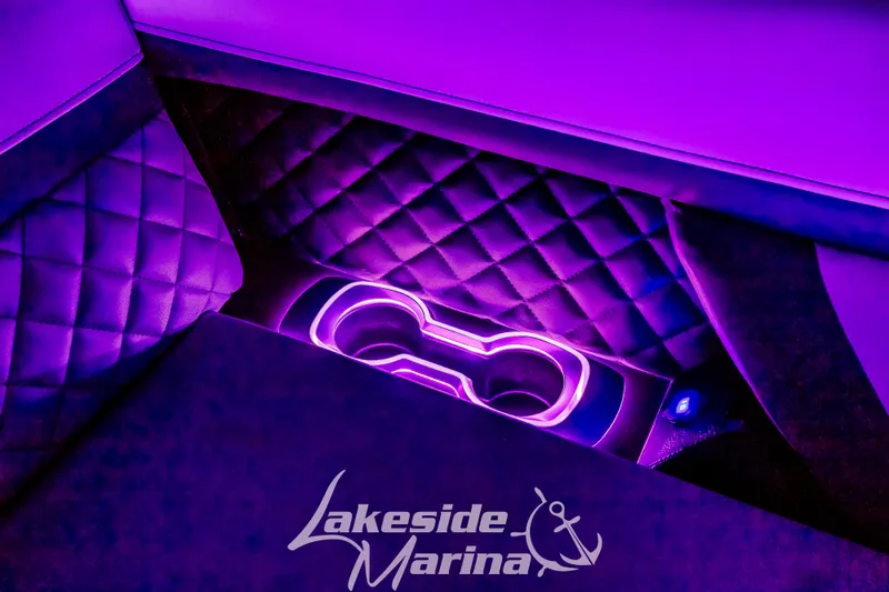 Slide: The Image of Luxurious interior of 2025 Godfrey AquaPatio 255 SBC with purple LED lighting. - 8
