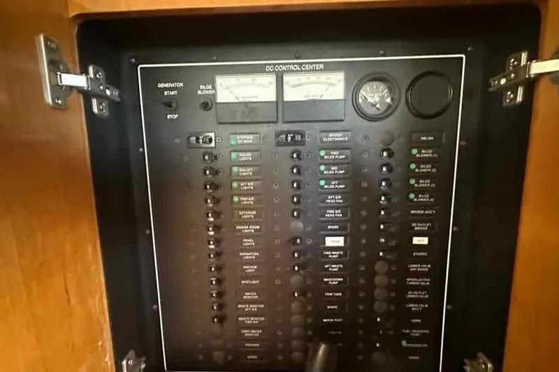 Slide: The Image of Control panel of a 2001 Carver 396 Motor Yacht, featuring various switches and gauges. - 30