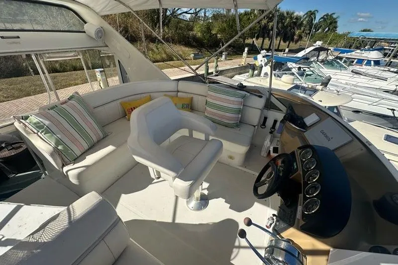 Slide: The Image of Interior view of 2001 Carver 396 Motor Yacht with seating and helm. - 6