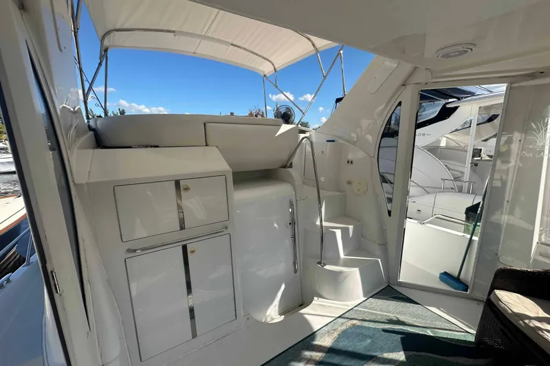 Slide: The Image of 2001 Carver 396 Motor Yacht interior with stairs and storage cabinets. - 8