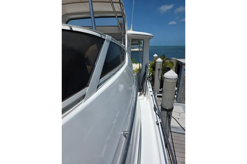 Slide: The Image of 2001 Carver 396 Motor Yacht docked by the ocean on a sunny day. - 11