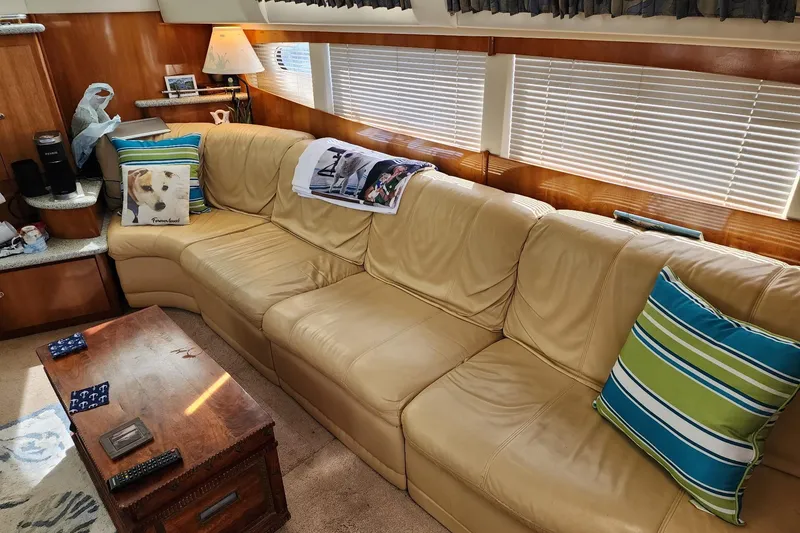 Slide: The Image of Luxurious interior of 2001 Carver 396 Motor Yacht with leather seating and decorative pillows. - 14