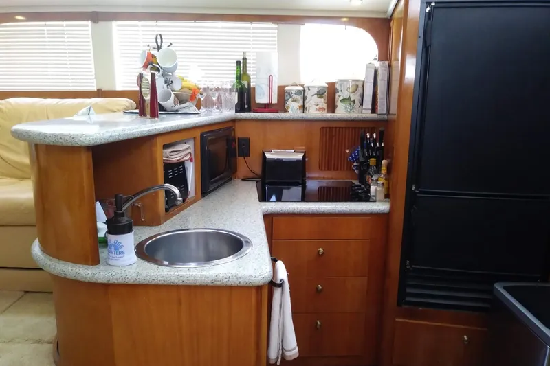 Slide: The Image of Luxurious kitchen area in 2001 Carver 396 Motor Yacht with modern amenities. - 20