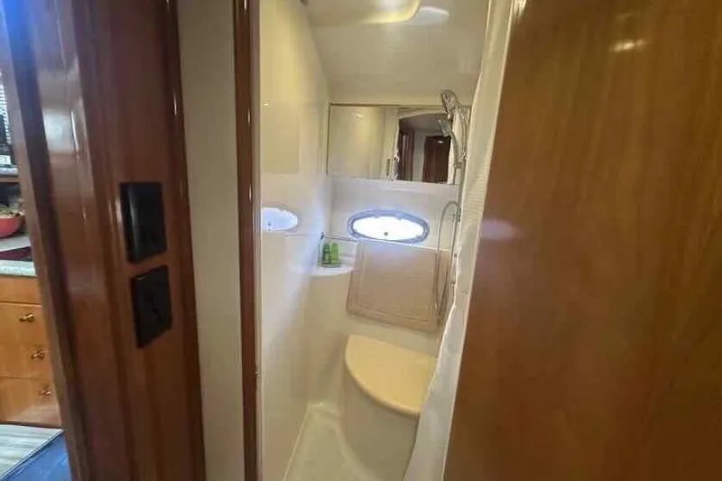 Slide: The Image of Bathroom interior of 2001 Carver 396 Motor Yacht with porthole and shower. - 28