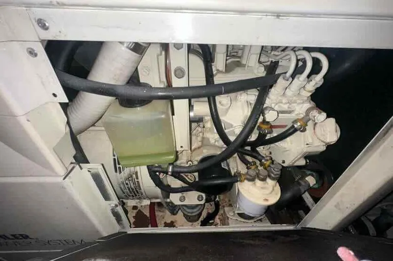 Slide: The Image of Engine compartment of a 2001 Carver 396 Motor Yacht, showing hoses and components. - 31