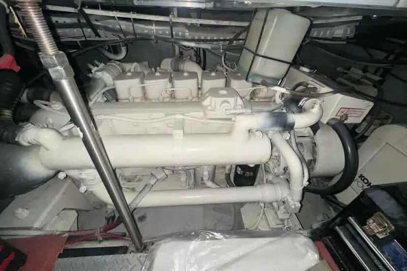 Slide: The Image of Engine room of a 2001 Carver 396 Motor Yacht, showcasing mechanical components. - 33