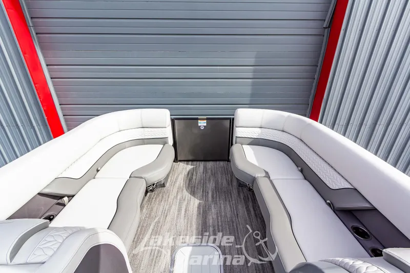 Slide: The Image of 2025 Godfrey Monaco 235 SB boat interior with luxurious seating and modern design. - 11