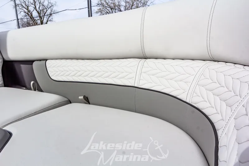 Slide: The Image of Luxurious seating on 2025 Godfrey Monaco 235 SB boat with intricate stitching design. - 12
