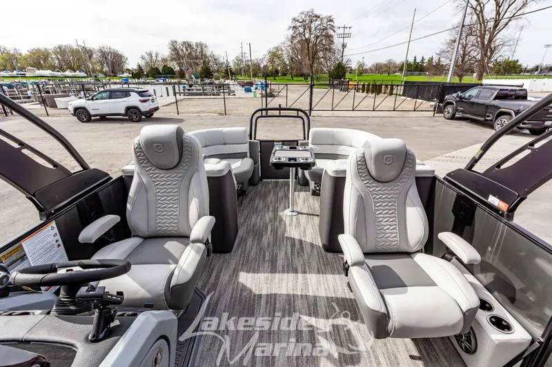 Slide: The Image of 2025 Godfrey Monaco 235 SB pontoon boat interior with luxurious seating at Lakeside Marina. - 13