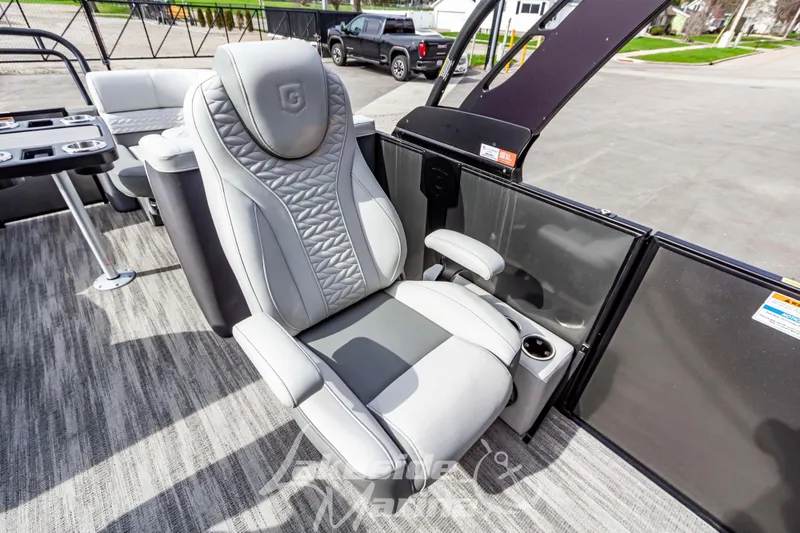 Slide: The Image of Luxurious seating on 2025 Godfrey Monaco 235 SB pontoon boat, featuring modern design. - 14