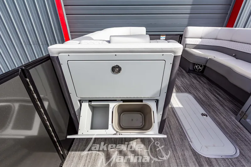 Slide: The Image of 2025 Godfrey Monaco 235 SB boat interior with storage compartment and seating. - 16