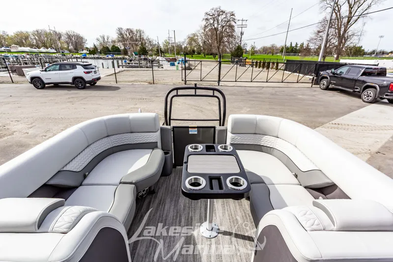 Slide: The Image of 2025 Godfrey Monaco 235 SB pontoon boat with luxurious seating and cup holders. - 24