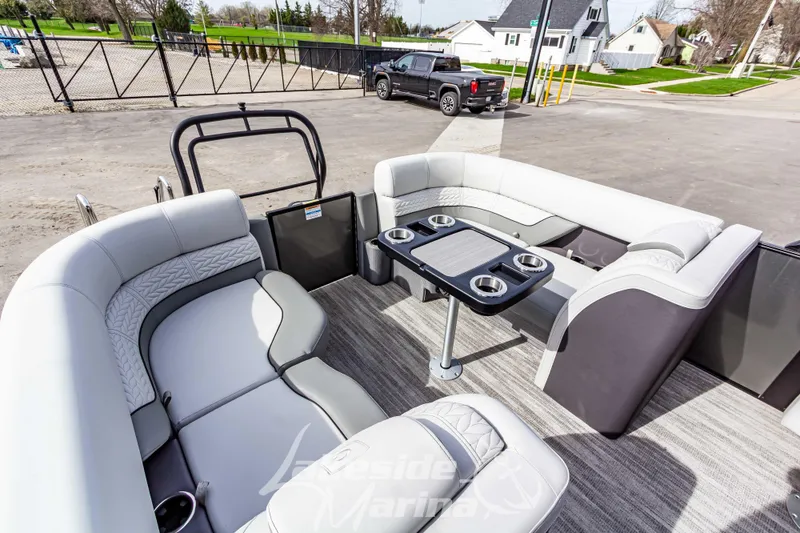 Slide: The Image of Luxurious interior of 2025 Godfrey Monaco 235 SB pontoon boat with plush seating and table. - 26