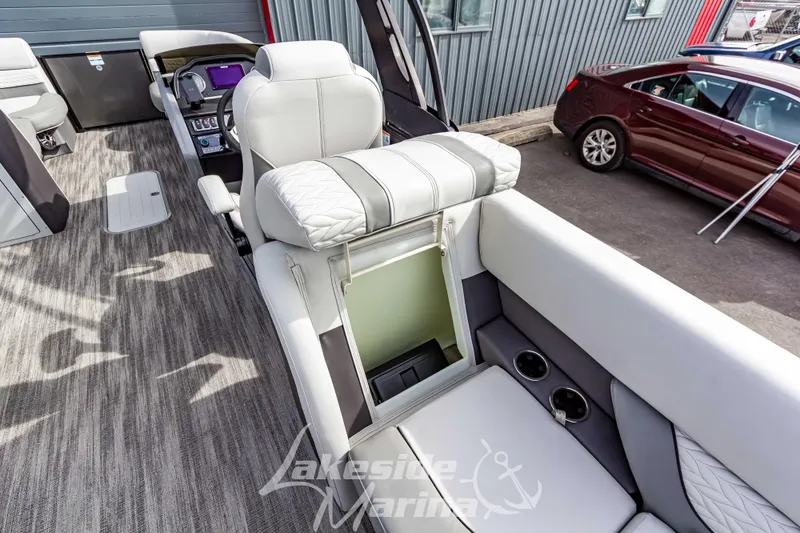 Slide: The Image of 2025 Godfrey Monaco 235 SB boat interior with luxurious seating and modern dashboard. - 28