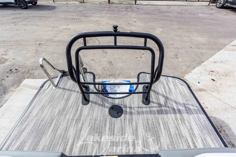 Slide: The Image of 2025 Godfrey Monaco 235 SB boat deck with safety railing and ladder. - 30