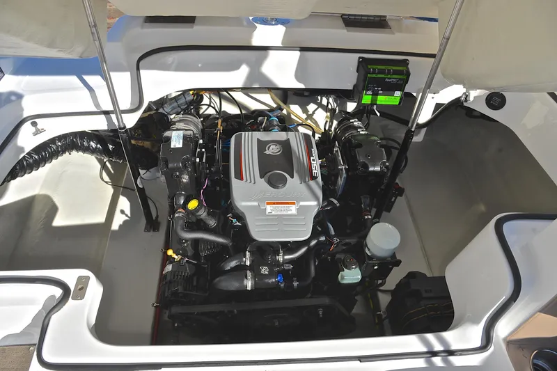 Slide: The Image of Engine compartment of a 2008 Cobalt 222 boat, featuring a MerCruiser engine. - 27