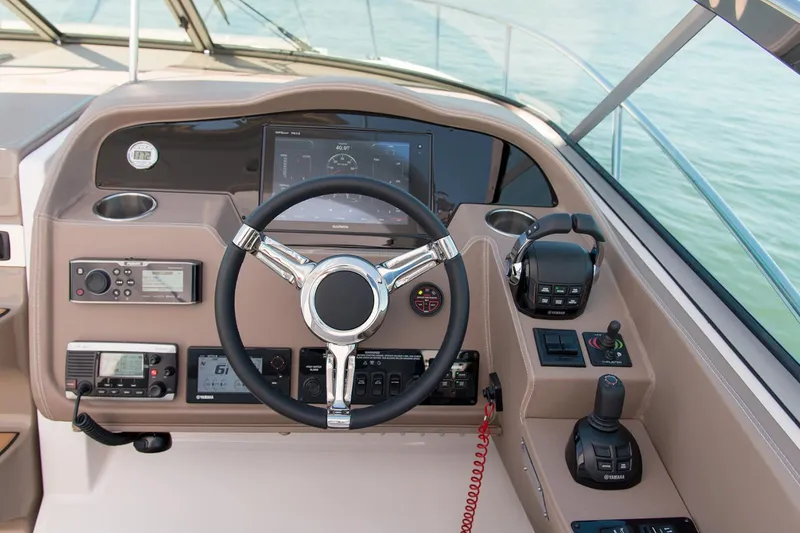 Slide: The Image of 2021 Regal 33 XO boat with black cover docked at marina. - 5