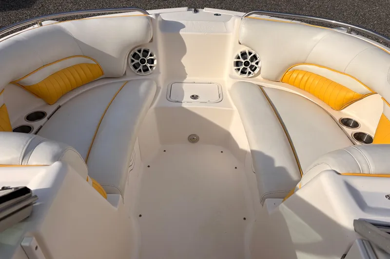 Slide: The Image of 2008 Hurricane SunDeck 2000 OB boat interior with white and yellow seating. - 11