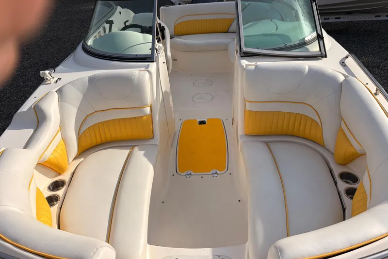 Slide: The Image of 2008 Hurricane SunDeck 2000 OB boat interior with yellow and white seating. - 16